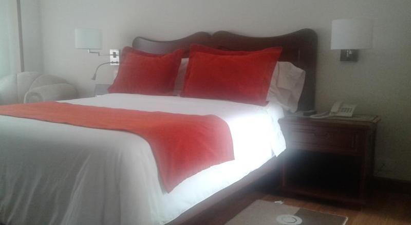 Hotel Santa Lucia Boutique Spa Bogotá Kültér fotó A bed with a duvet cover